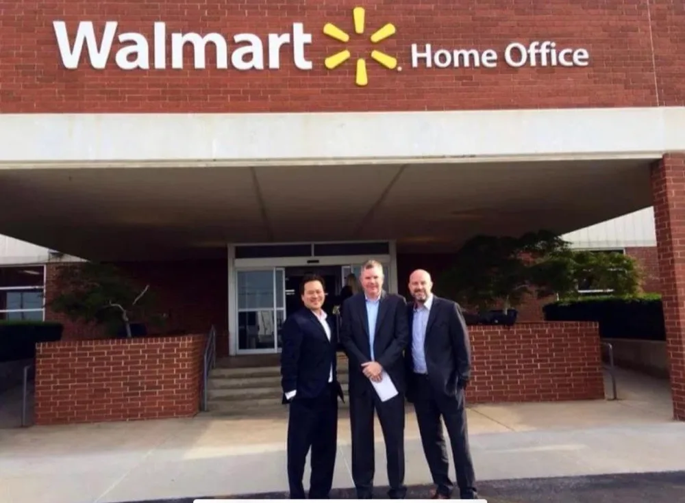 Angus Nelson with two colleagues outside the Walmart Home Office